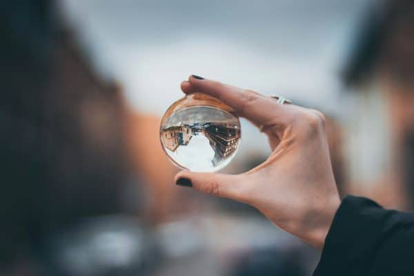 Woman holding clear glass ball