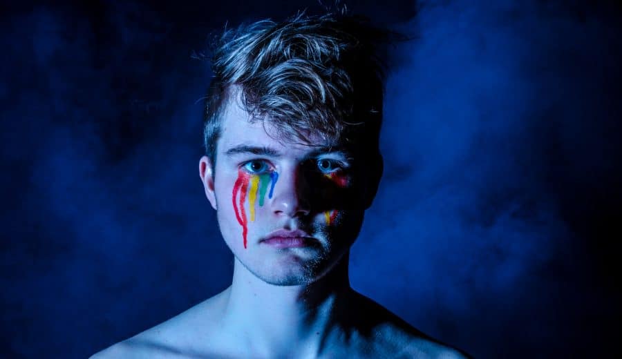 Man crying rainbow colors
