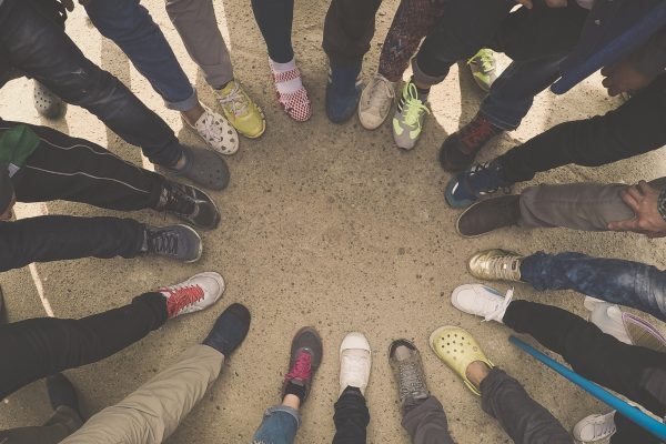 People with their feet in a circle
