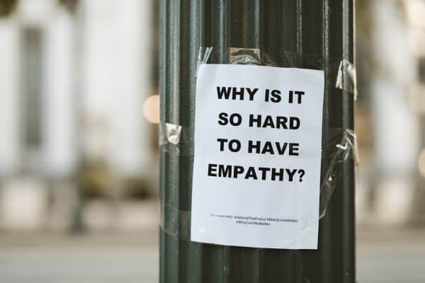 Why is it so hard to have empathy, flyer on a pole in downtown Los Angeles