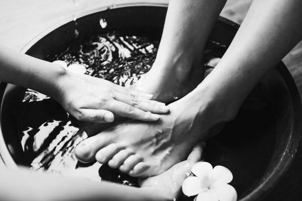 Closeup of foot spa therapy and massage