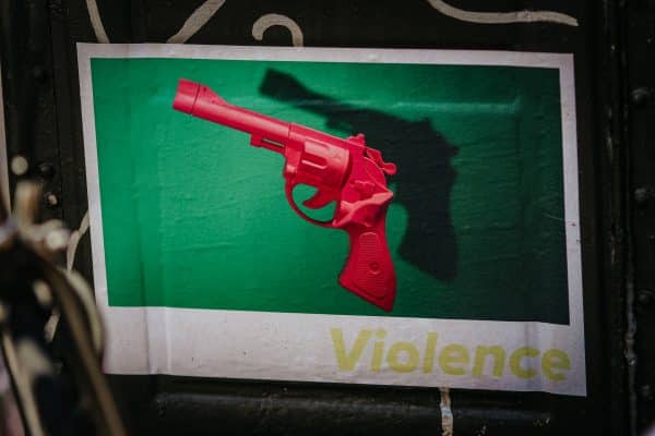 Red pistol on green and white background
