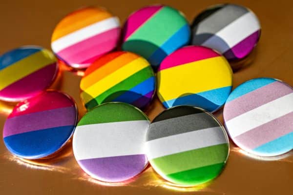 A bunch of colorful buttons sitting on top of a table