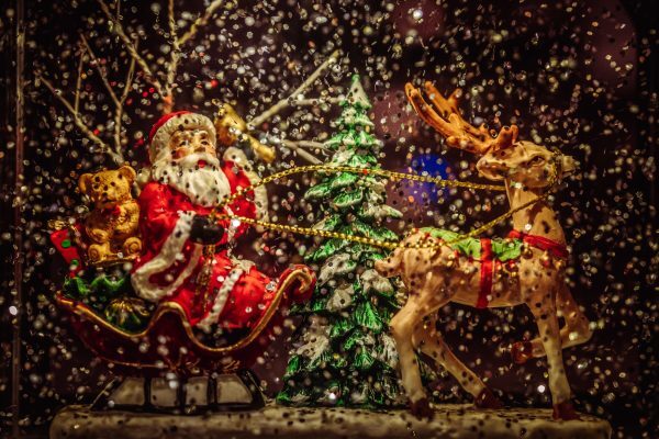 Christmas ornament with reindeer Santa and sleigh