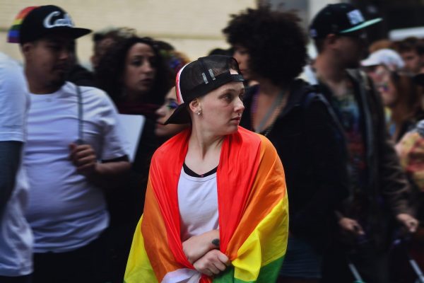 Woman wrapped in Pride flag