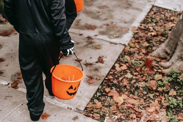 Children trick or treating in Halloween costumes