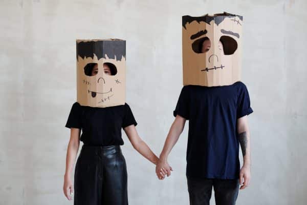 Man and woman wearing masks
