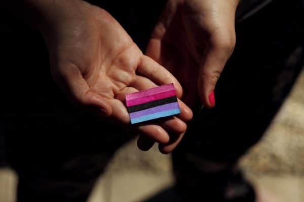 Person holding pink paper