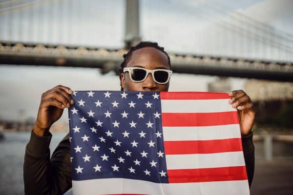 Black man holding American flag