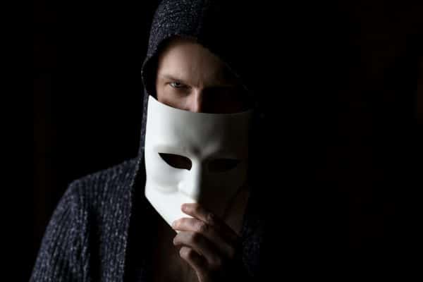 Man removing mask