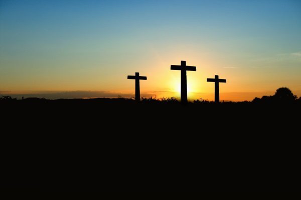 Three Calvary crosses at sunrise
