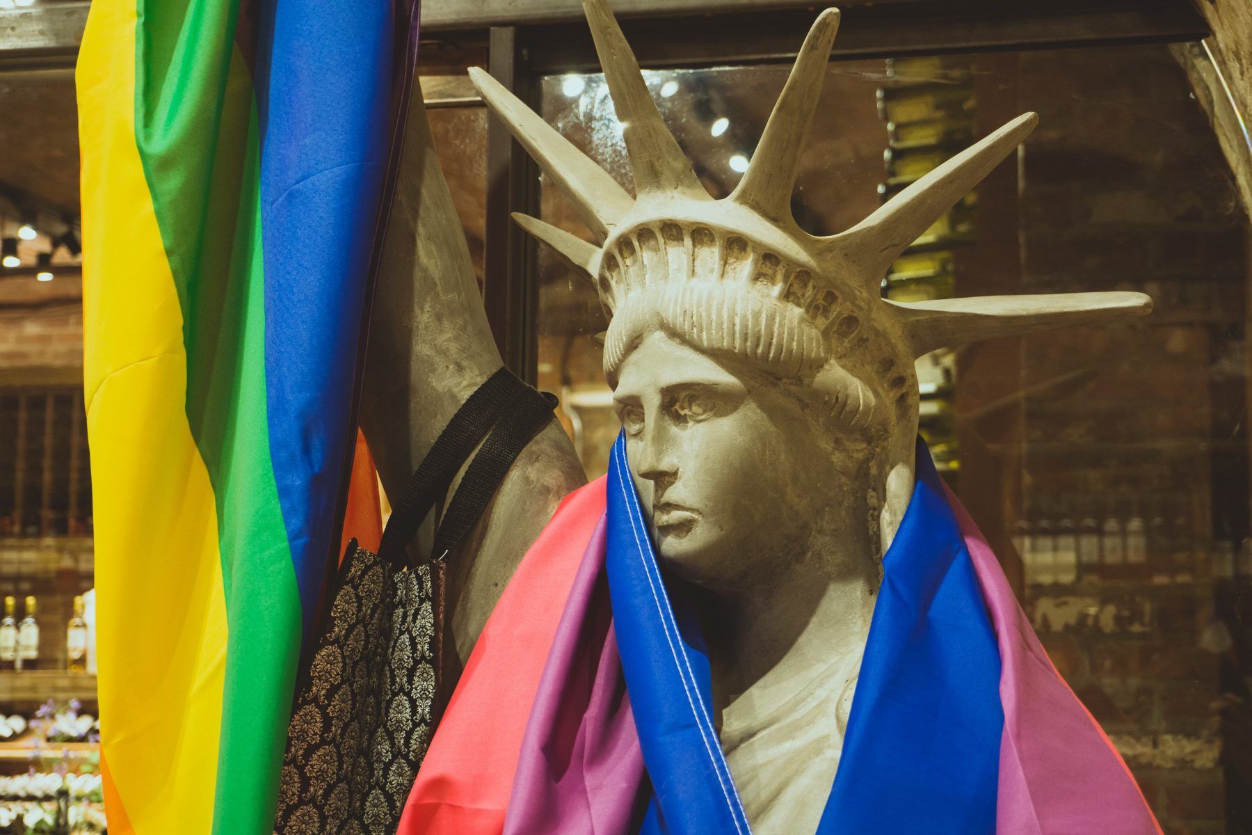 Lady Liberty draped in Pride flag